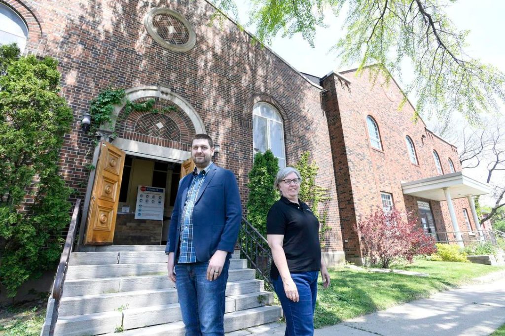 Indwell has purchased Wentworth Baptist Church at 120 Wentworth St. N. in Hamilton. In this photo, lead pastor Rev. Seán McGuire and Teresa Howe of Indwell in front of the sanctuary where Indwell plans to develop more than 40 affordable housing units.