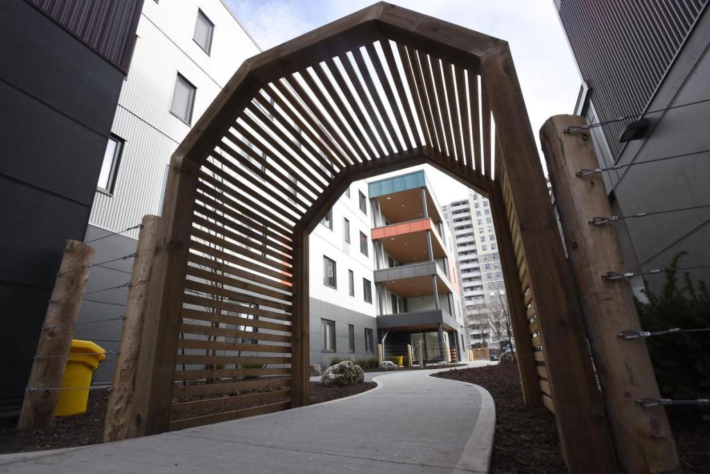 An archway leading from Parkdale Avenue to front door of the McQuesten Lofts, 256 Parkdale Ave. N., an Indwell affordable housing development.